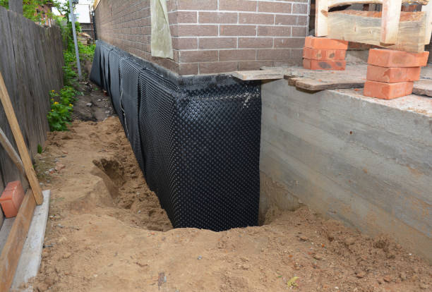 Happy homeowners after waterproofing job in Eldridge